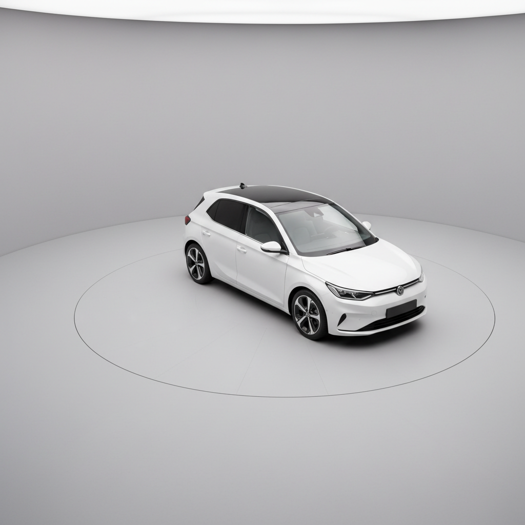 A clean, overhead three-quarter view of a metallic white compact car parked in a designated photo bay with a uniform light-gray floor and backdrop. The vehicle is perfectly centered with all doors, hood, and trunk closed to present a tidy, catalog-style appearance. Balanced studio lighting from multiple directions eliminates harsh shadows and ensures every contour is clearly visible, from the roofline to the alloy wheels. The overall composition uses rule of thirds to leave negative space on one side, suitable for web overlays. Photographic realism with a modern, minimal aesthetic, ideal for use in a dynamic inventory grid where consistency and clarity across vehicle images are crucial.